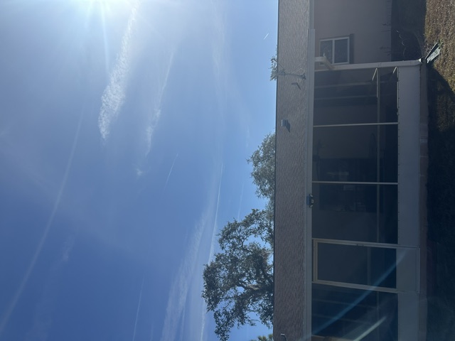 Edgewater Florida stucco home before painting screened porch